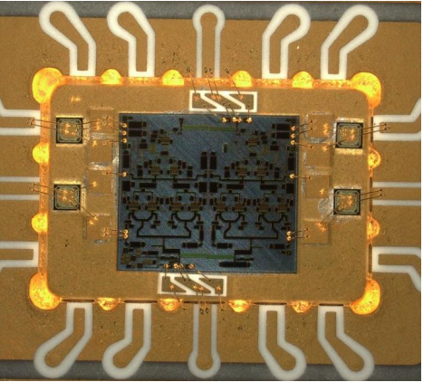 Image of ICP2840 bonded into Kyocera package with alumina inserts and chip capacitors.